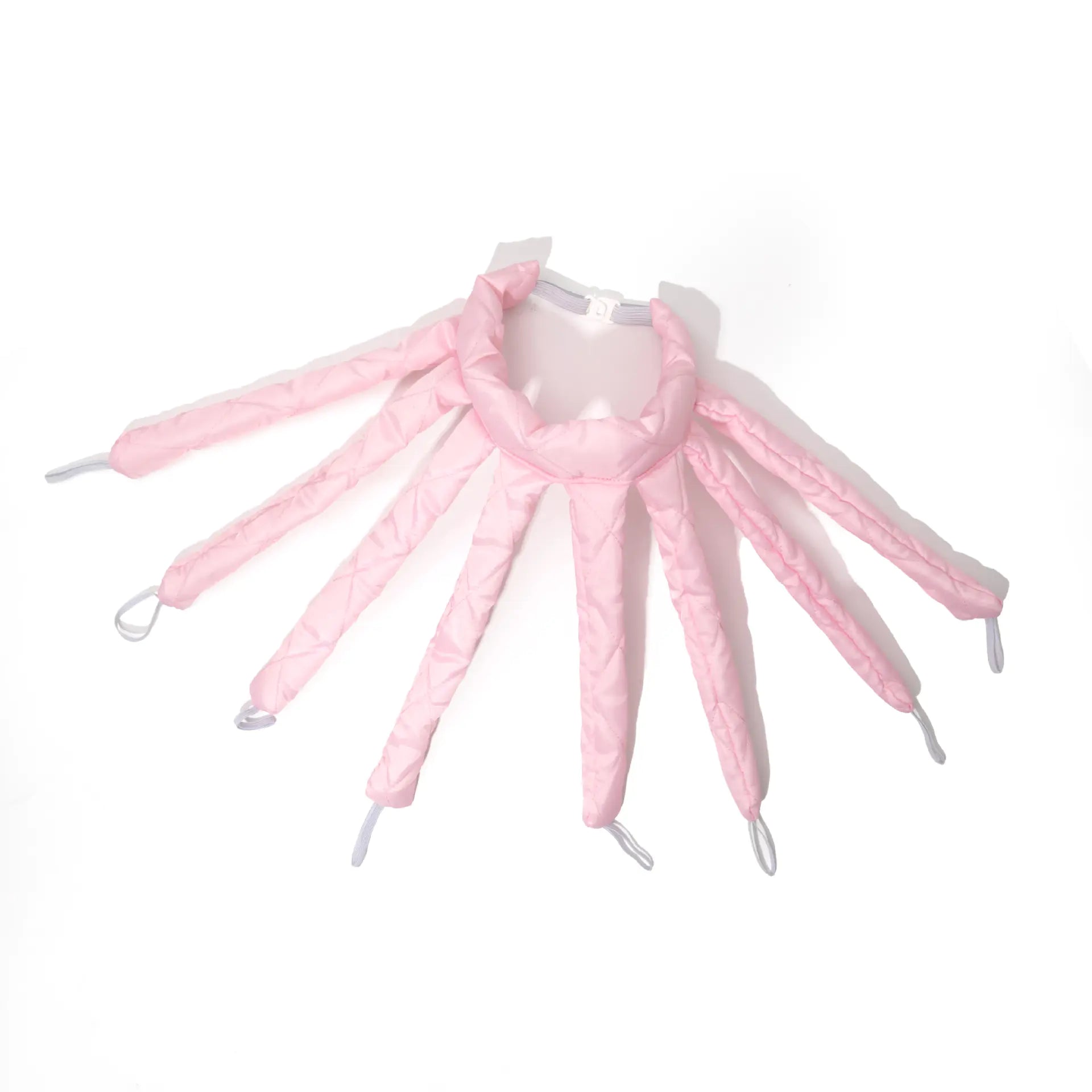 Pink shoe trees on a white background